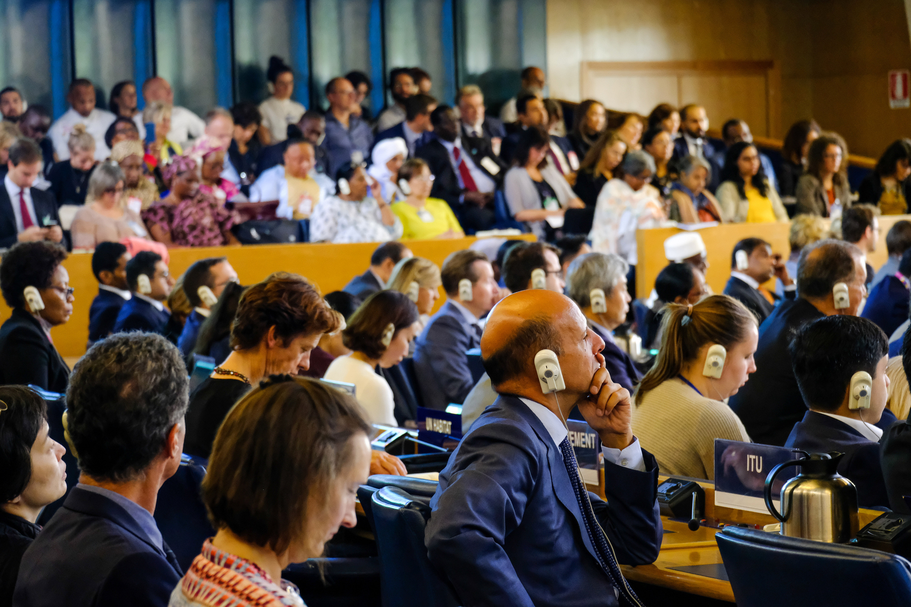 Delegates from around the world listen during the main session on the first day of CFS46.